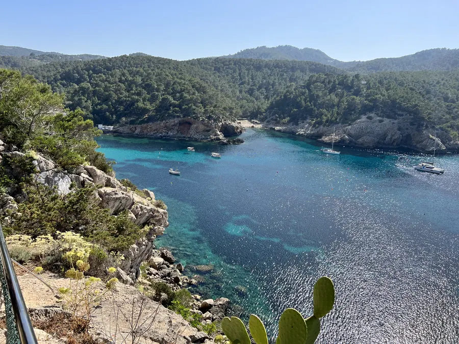 Turquoise cala with boats, north Ibiza